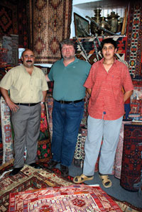 Dmitry in a carpet shop in Baku, with the owner and his assistant Ilchin. The shop is next to the Sultan Restaurant near Maiden Tower