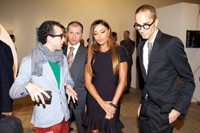 First Lady Mehriban Aliyeva views the exhibits with curator Herve Mikaeloff (right)