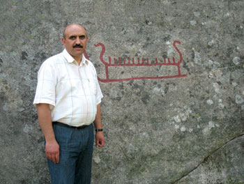 Yusif Mirza with rock carving, Halden, Norway