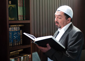 Salman Musayev, Deputy Head of the Muslim Board for the Caucasus, examines literature in the London Central Mosque