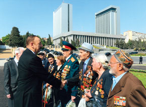 President Ilham Aliyev congratulates war veterans on Victory Day, 9 May. Amirali Amiraliyev is 3rd from the right