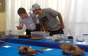 Young researchers examing the finds
