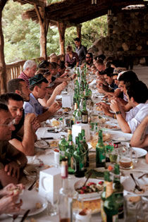 Table Sags Under Georgian Feast on Banks of Mikhavri River VERT