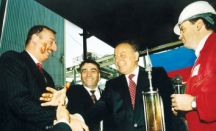 President Heydar Aliyev, Ilham Aliyev (currently the president of Azerbaijan) and Natiq Aliyev, Chairman of SOCAR (currently Minister of Industry and Energy of Azerbaijan), celebrate the first oil production following the signing of the Contract of the Century at a ceremony on 12 November 1997