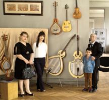 Elshad with family surrounded by his instruments at his summer exhibition in the Museum Centre