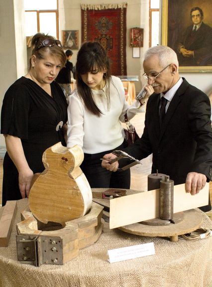 Elshad and family inspecting other instruments on display at the Museum Centre
