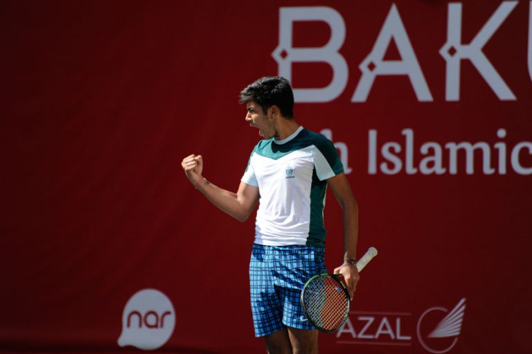 Azerbaijani tennis player 17-year-old Rasul Gojayev celebrates a point in the men’s doubles on 13 May. Photo: Eldar Farzaliyev